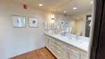 Primary bedroom en-suite bathroom with double vanity granite sinks